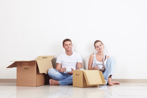 Professional movers loading furniture for a local relocation